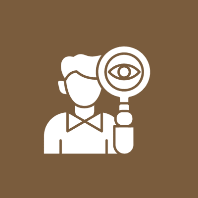 Person holding magnifying glass with eye.